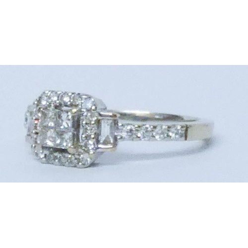 679 - 18ct white gold modern diamond cluster ring, with a central square pave panel to stepped diamond sho... 