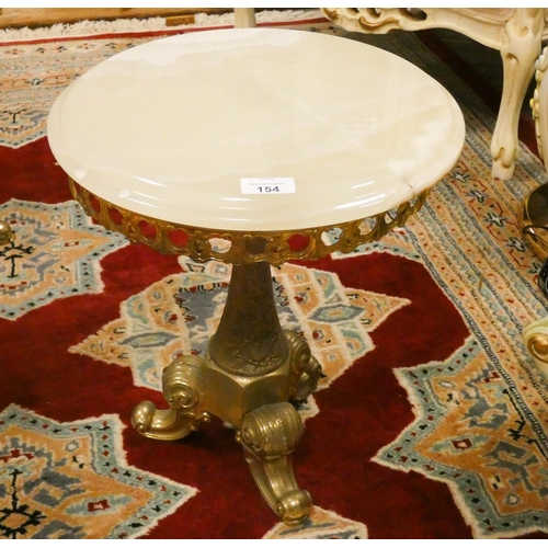 154 - A brass framed circular wine table with cream onyx top