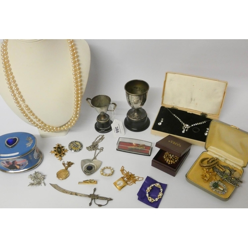 386 - Modern Titanic china musical box, two silver plated trophy cups and a quantity of costume and paste ... 