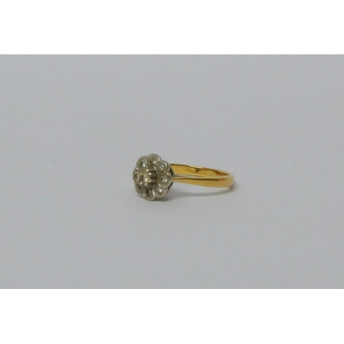 567 - 18ct gold flower design diamond ring, hallmarked. Ring size L, gross weight 3.3 grams