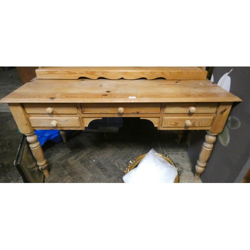 323 - A stripped pine desk fitted five drawers standing on turned legs, 4'6 wide