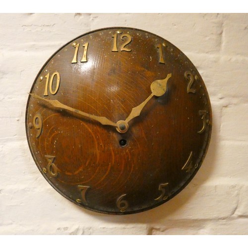 338 - An Arts & Crafts  oak convex wall clock with brass applied numerals. Impressed number 8103 to revers... 