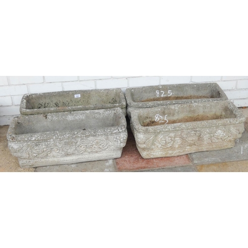 825 - Four matching trough shaped reconstituted stone garden planters...