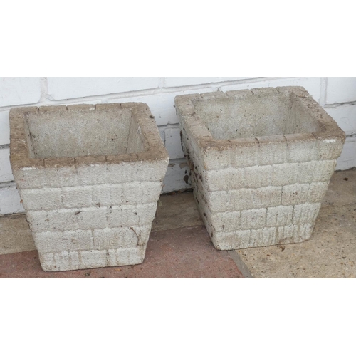 829 - A small pair of square garden concrete pots