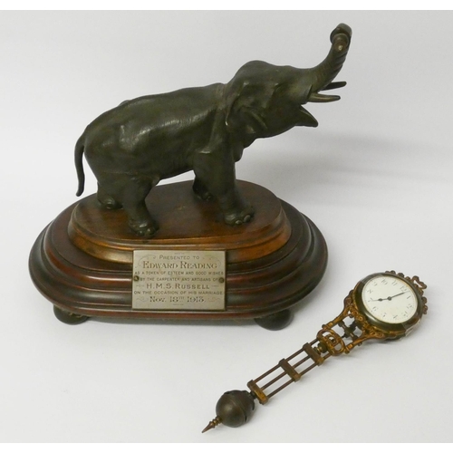 448 - An elephant mystery clock with presentation plaque, 