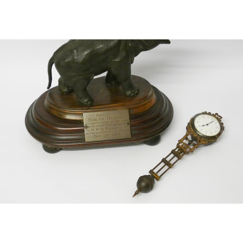 448 - An elephant mystery clock with presentation plaque, 