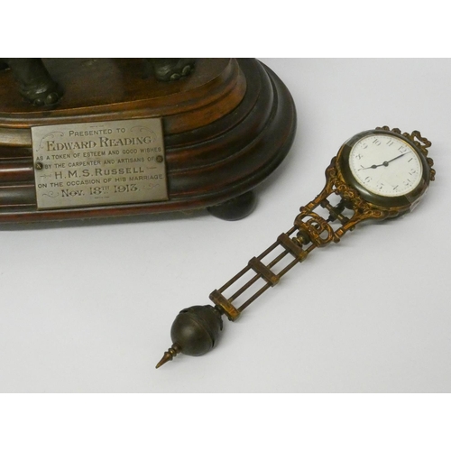 448 - An elephant mystery clock with presentation plaque, 