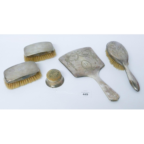 449 - An Edwardian silver backed dressing table mirror and matching hair brush, two silver backed clothes ... 