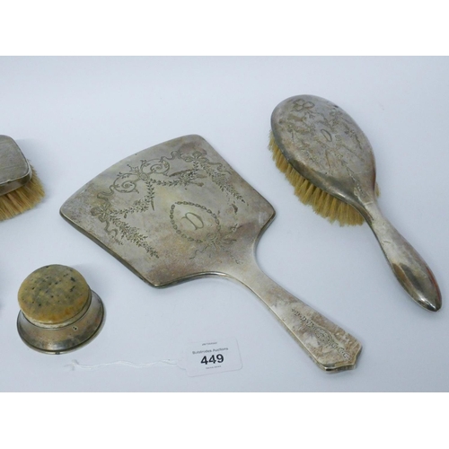 449 - An Edwardian silver backed dressing table mirror and matching hair brush, two silver backed clothes ... 