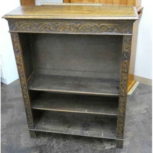 28 - A low carved oak open bookcase, 3' wide...