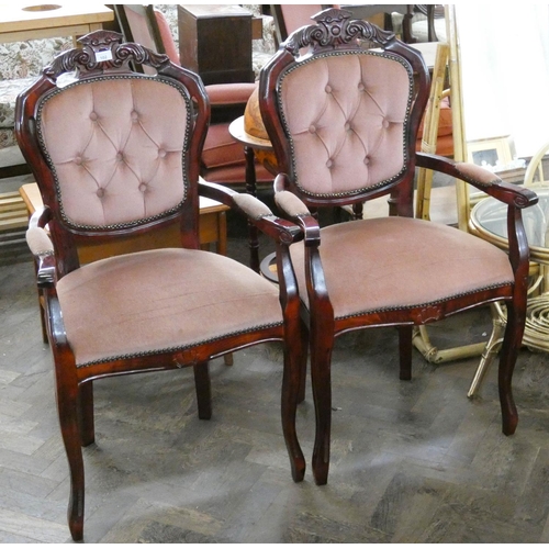 130 - A pair of French style mahogany elbow chairs with pink upholstered seats and backs