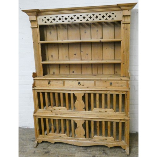 400 - A good antique waxed pine hutch style kitchen dresser with closed panel back above three spice drawe... 