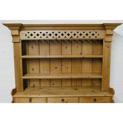 400 - A good antique waxed pine hutch style kitchen dresser with closed panel back above three spice drawe... 