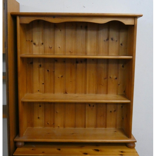 23 - A low modern pine open bookcase, 34