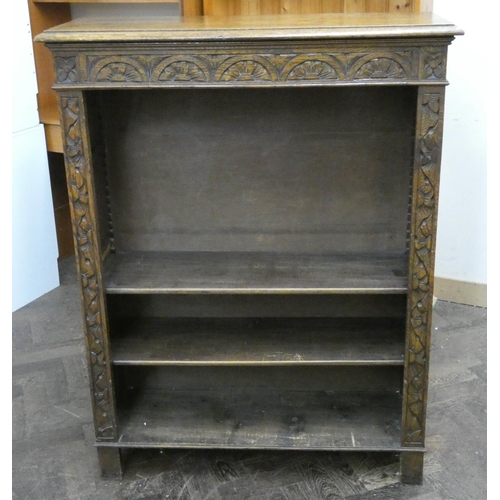 28 - A low carved oak open bookcase, 3' wide...