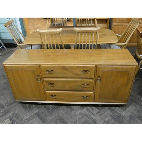 3 - An Ercol light elm low sideboard fitted three centre drawers and cupboards, 61