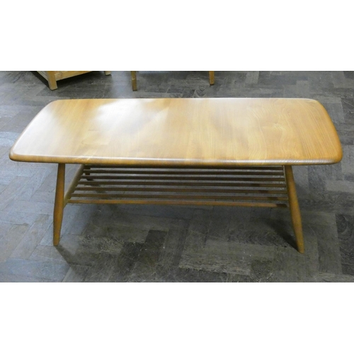 4 - An Ercol light elm long coffee table with under tier...