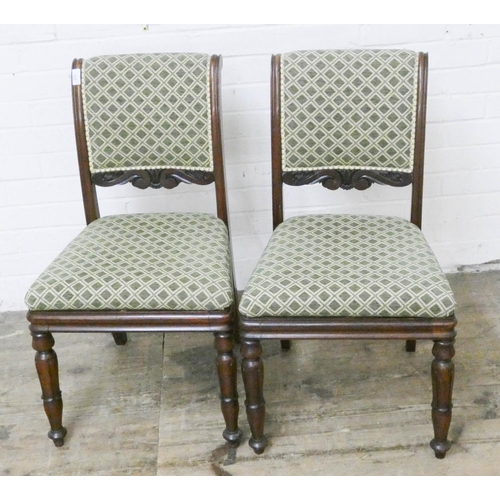 121 - A pair of mahogany dining room chairs with green patterned upholstered seats and backs