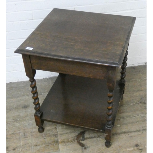 123 - A square oak two tier occasional table on barley twist legs