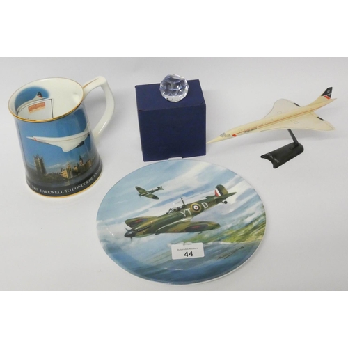 44 - A model of Concorde, Swarovski Concorde paperweight, commemorative tankard and a Spitfire wall plate...