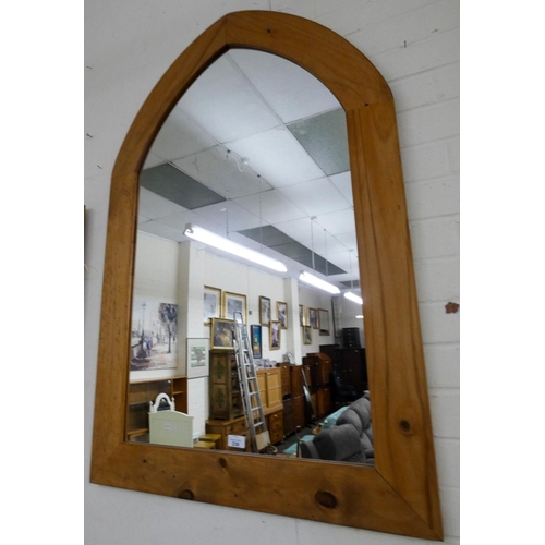 238 - A large pine Gothic arched wall mirror