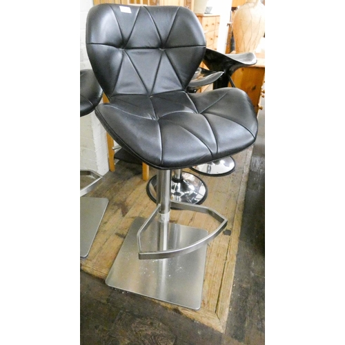 239 - A pair of padded black faux leather and stainless steel base kitchen stools