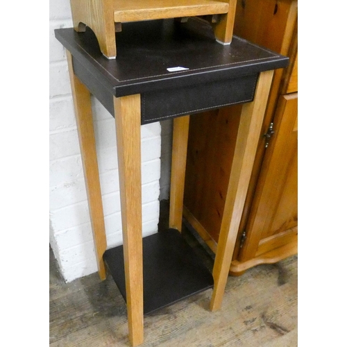 240 - A small oak CD rack and a dark brown leather and oak two tier plant pedestal