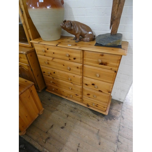 246 - A varnished pine combination chest of five long and five short drawers