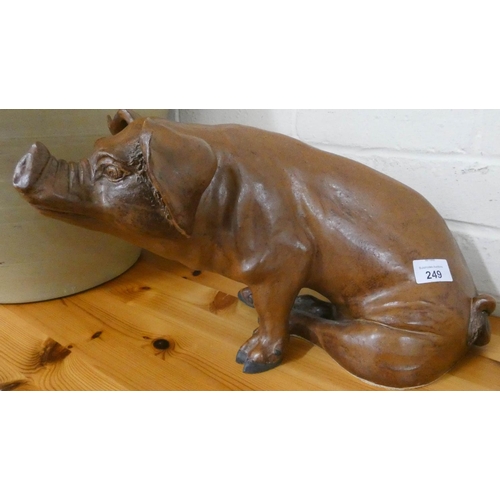 249 - A large pottery model of a seated pig