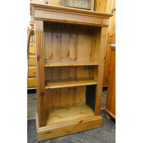 255 - A modern varnished pine bookcase with arcaded panels