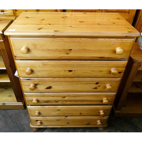 256 - A varnished pine tallboy chest of six long drawers