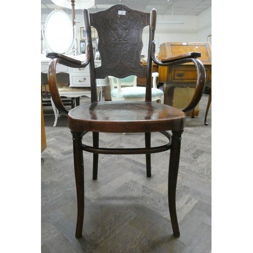 57 - A Bentwood elbow chair...