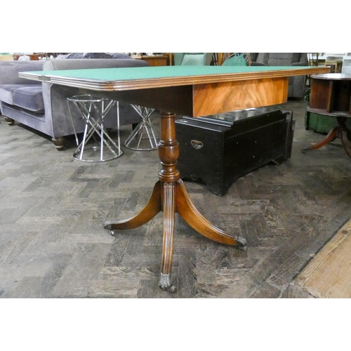 58 - A Georgian style mahogany fold over top card table on pillar and quadruple base, 3' wide...