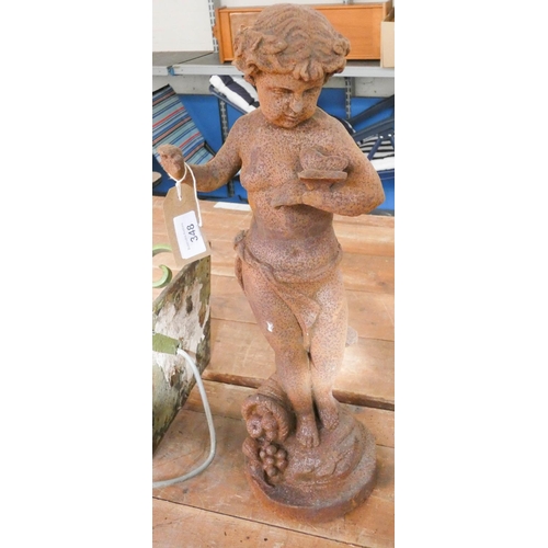 336 - A rusty garden ornament of a child with butterfly approx 20