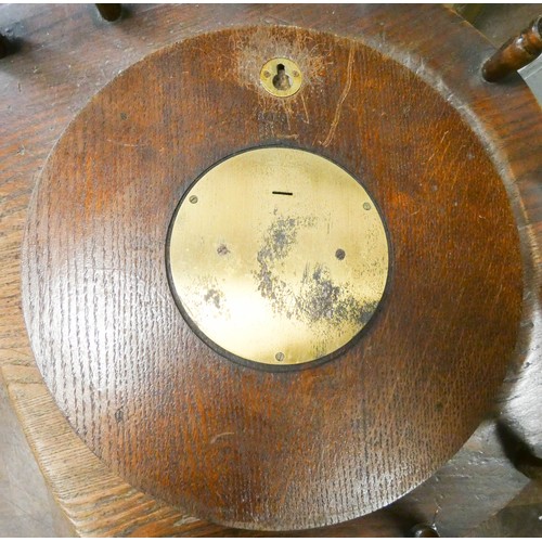 338 - An Arts & Crafts  oak convex wall clock with brass applied numerals. Impressed number 8103 to revers... 