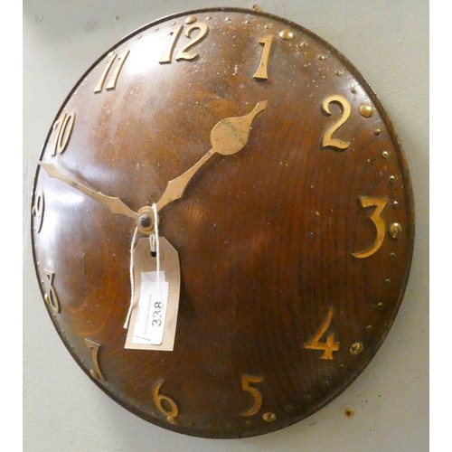 338 - An Arts & Crafts  oak convex wall clock with brass applied numerals. Impressed number 8103 to revers... 