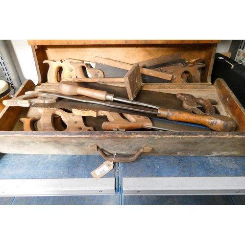 376 - An old carpenters tool box with extra saws and various tools