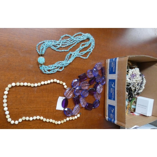 56A - A quantity of costume jewellery, beads etc...