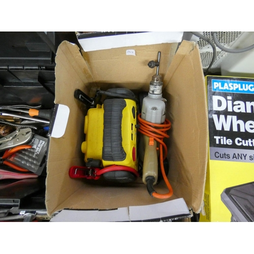 337 - A compact battery jump starter, an electric drill and a Workzone tool box with contents