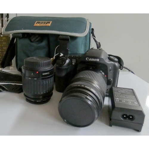 348 - A Canon camera with spare lenses etc in carrying case and some wooden rulers