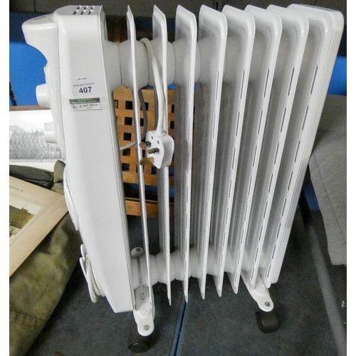 407 - Oil filled electric radiator and a folding table