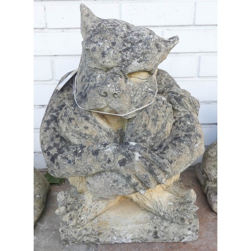 488 - A large weathered stone seated gargoyle