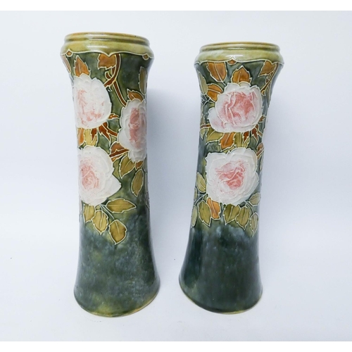 532 - A pair of Royal Doulton stoneware vases decorated with pink roses on a green marbled ground, height ... 