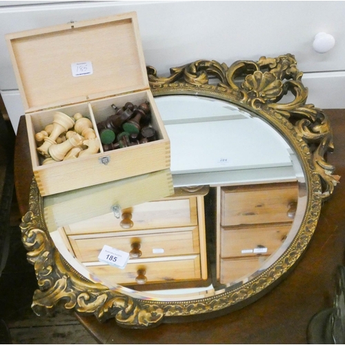 185 - Circular bevelled mirror in decorative gilt frame and a chess set in box