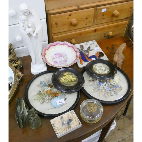 186 - A pair of flower pictures, Madonna and child ornament, tile, brass bell and other oddments