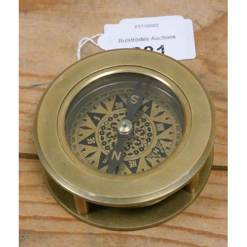 231 - A brass compass with magnifying lens