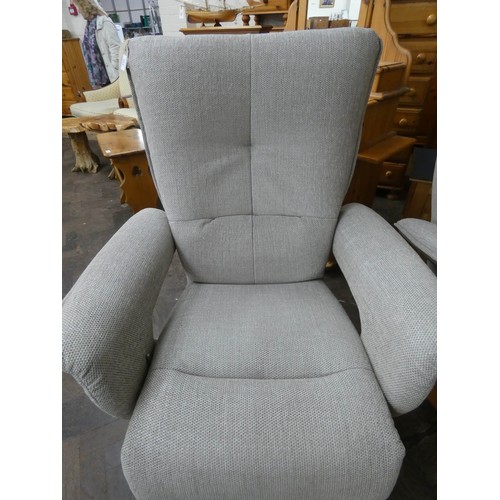 254 - A pair of modern Himolla swivel reclining easy chairs in a pale grey chenille