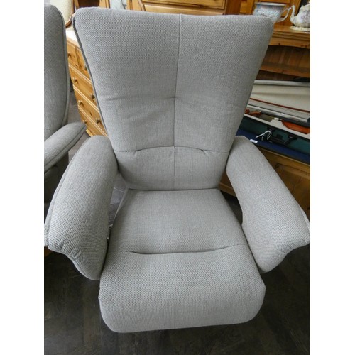 254 - A pair of modern Himolla swivel reclining easy chairs in a pale grey chenille