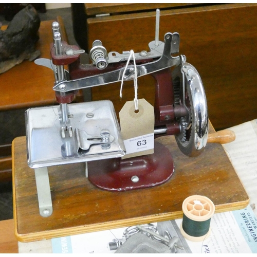 An Essex miniature sewing machine with original box and instructions