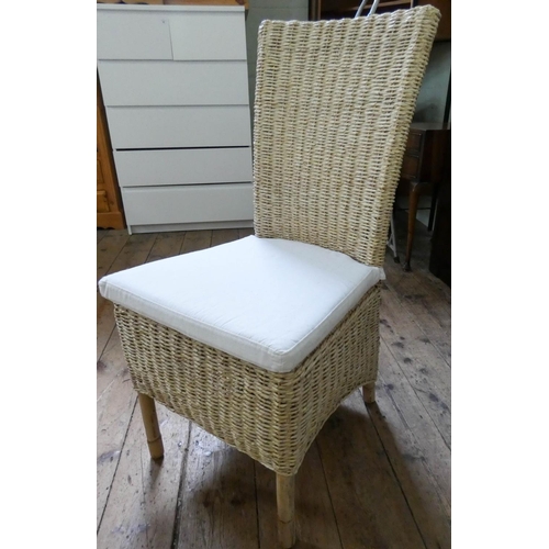 55 - A pair of modern cane dining or conservatory chairs with loose cushions